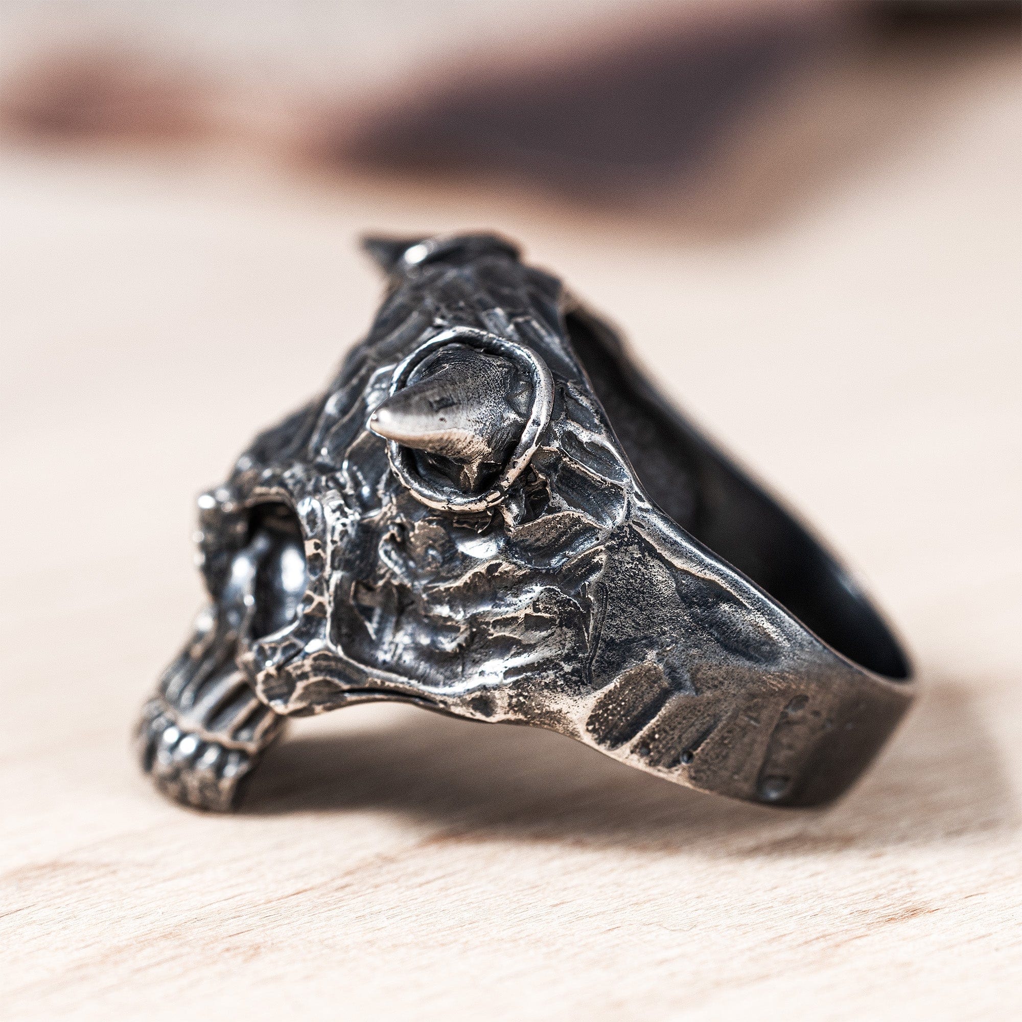 Ossicle Dark Sterling Silver Band with a Fierce Skull Design